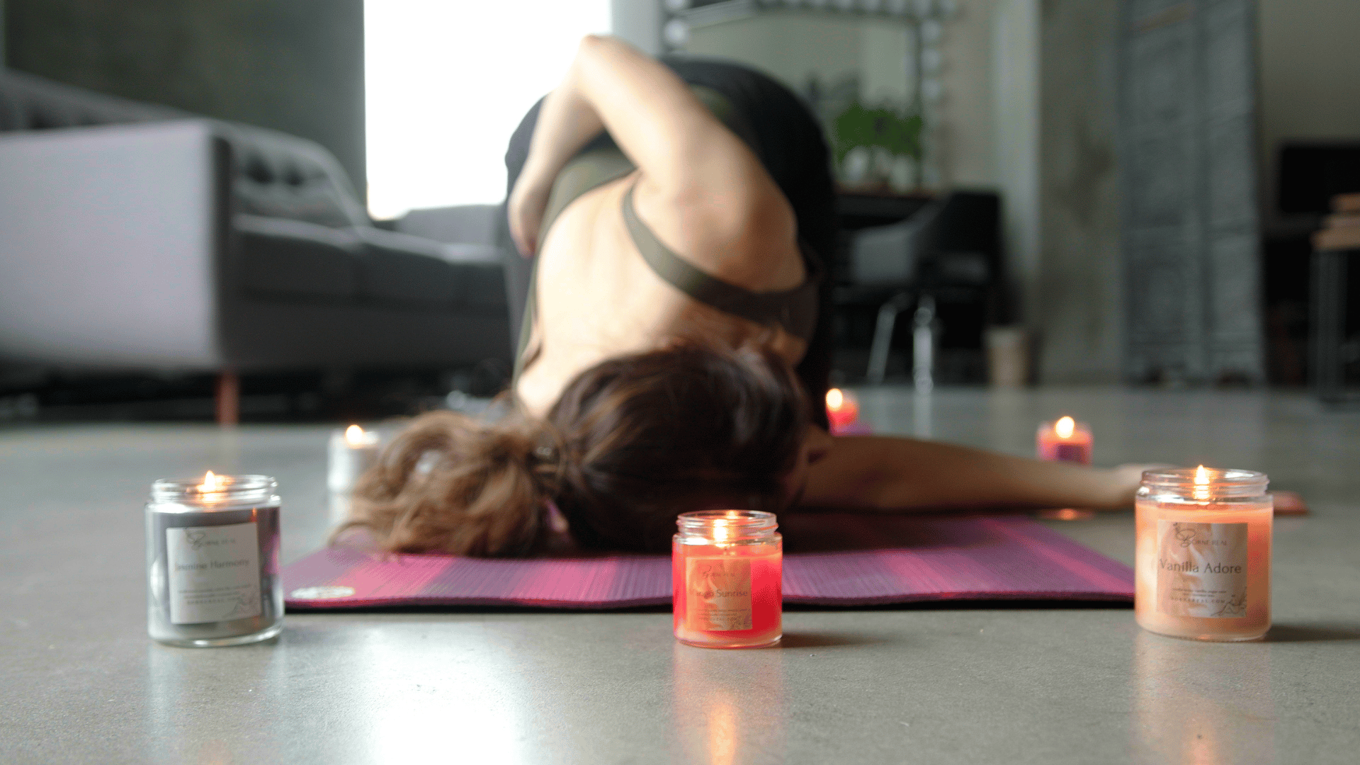 Load video: woman doing candlelit yoga